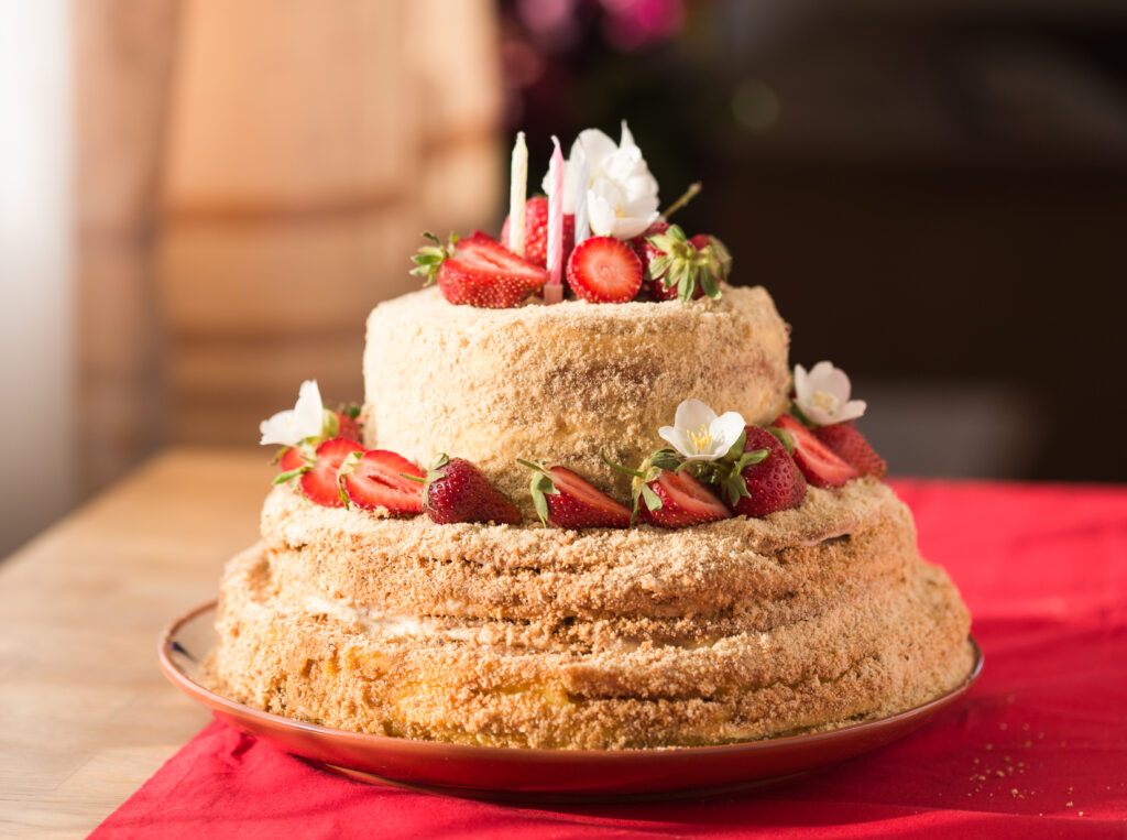 Stylish wedding cake with geometric patterns and fresh floral decorations