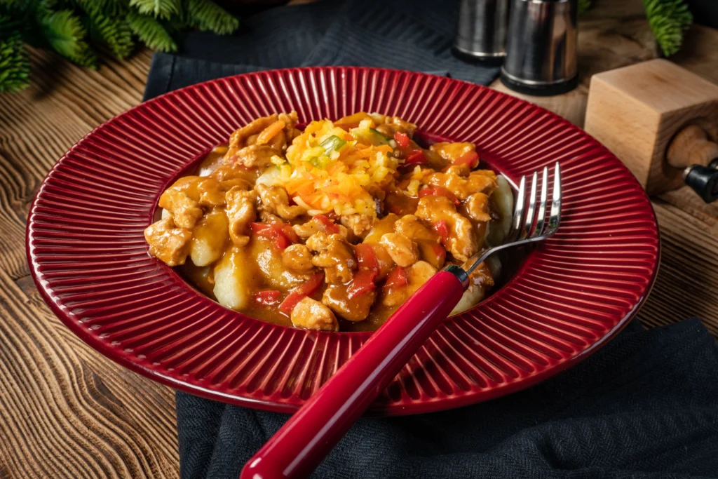 Deliciously plated chicken fricassee served with creamy sauce and garnished with fresh herbs, showcasing the dish's appetizing texture and rich flavor.