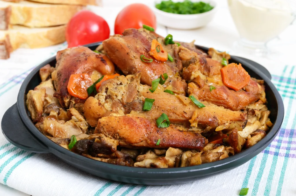 A sumptuous plate of chicken fricassee garnished with fresh herbs, served in an elegant setting.